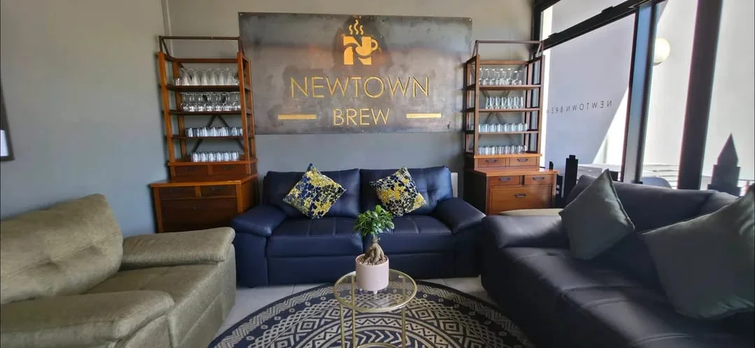 NewTown Brew lounge interior with branded wall sign
