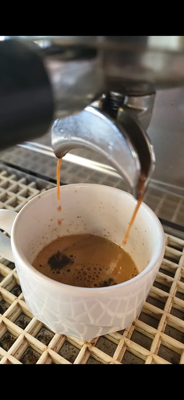 Fresh coffee being poured at NewTown Brew